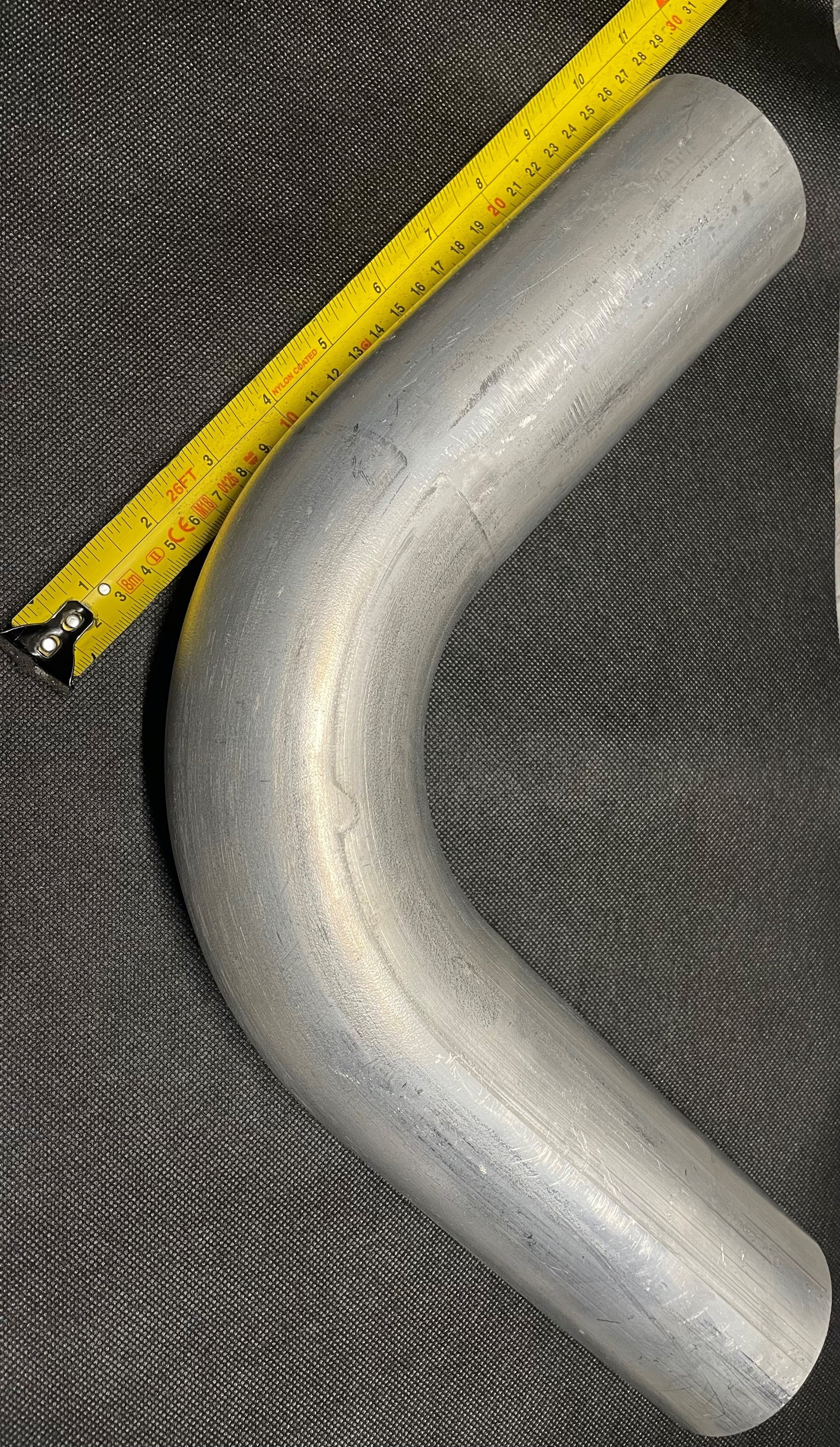 tape measure shows 250mm from bend to end of aluminium